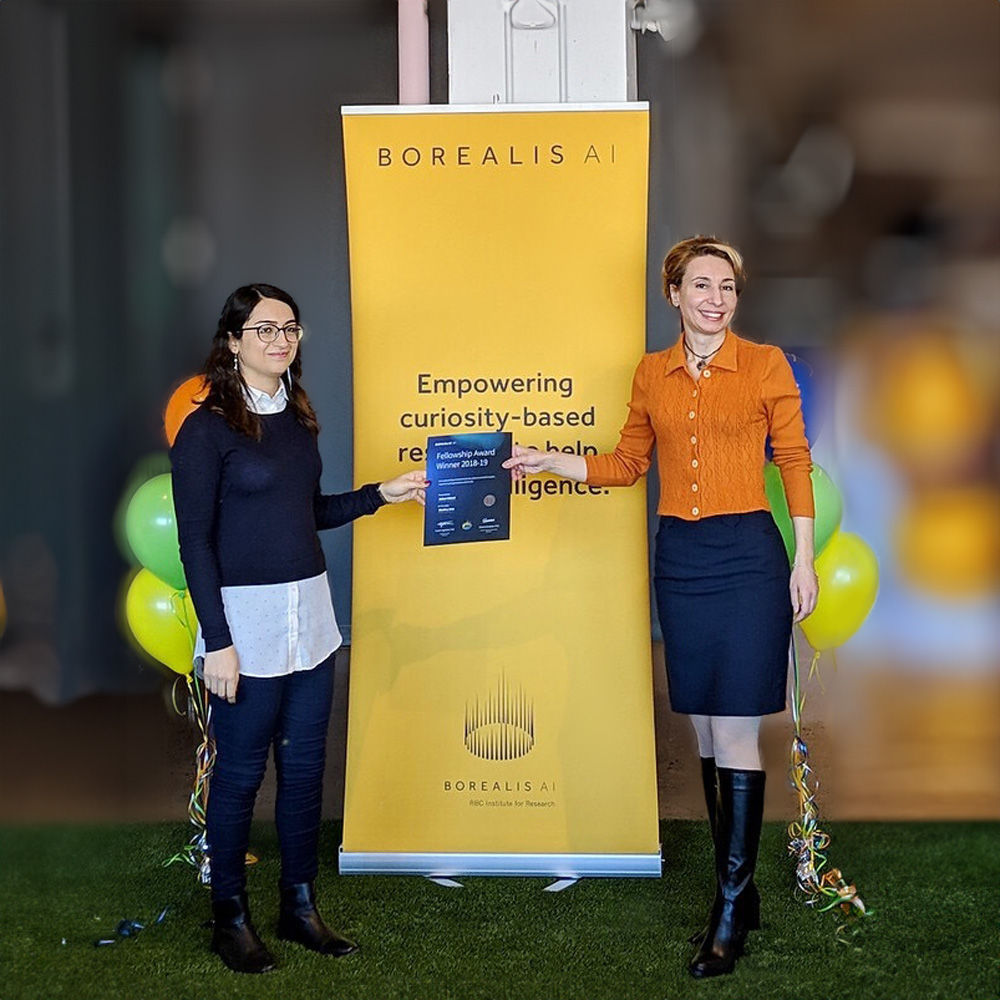 Eirene Seiradaki and a Borealis AI Fellowship Candidate receiving a certificate.