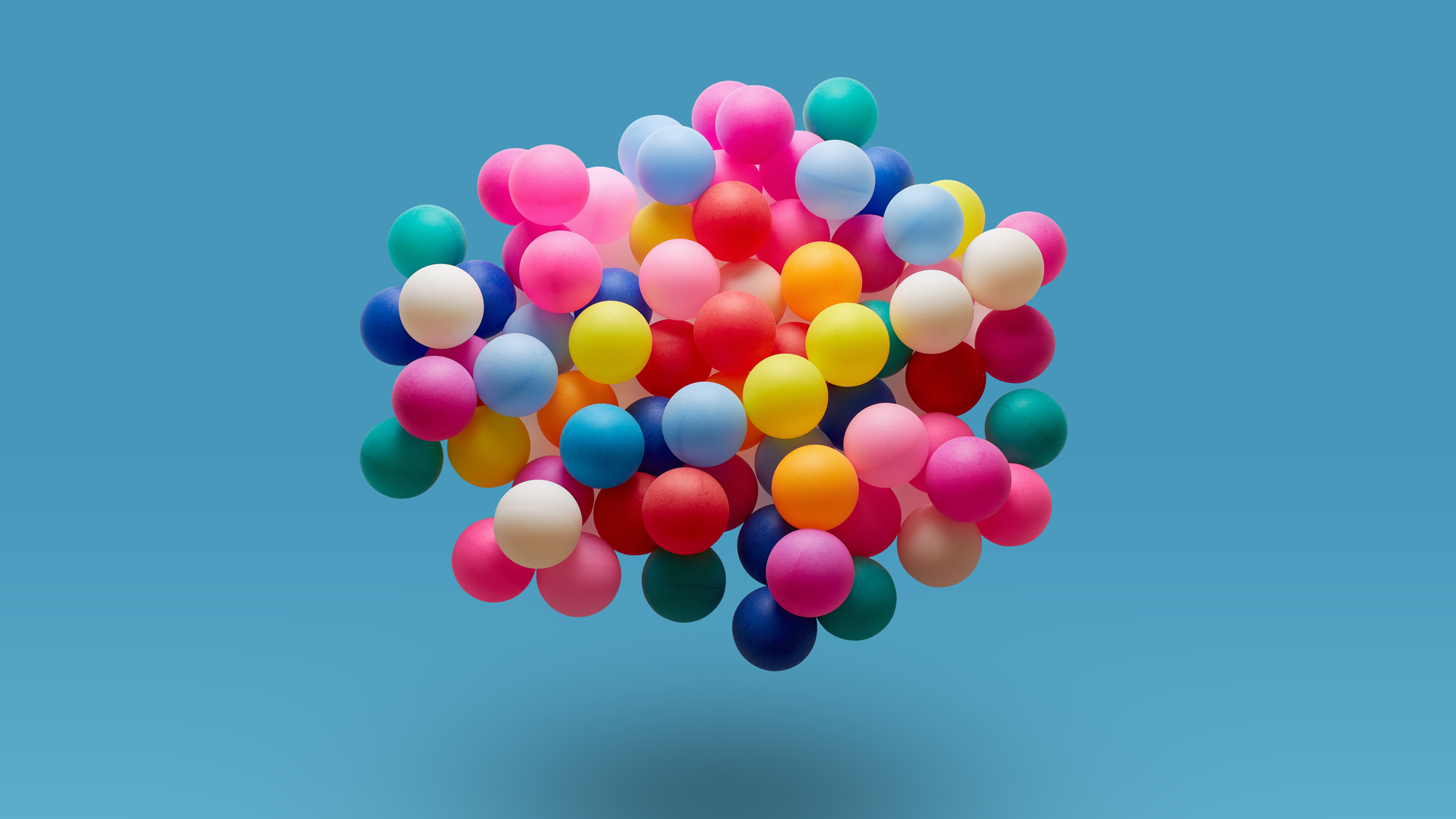 A colourful arrangement of balloons in the shape of a brain.