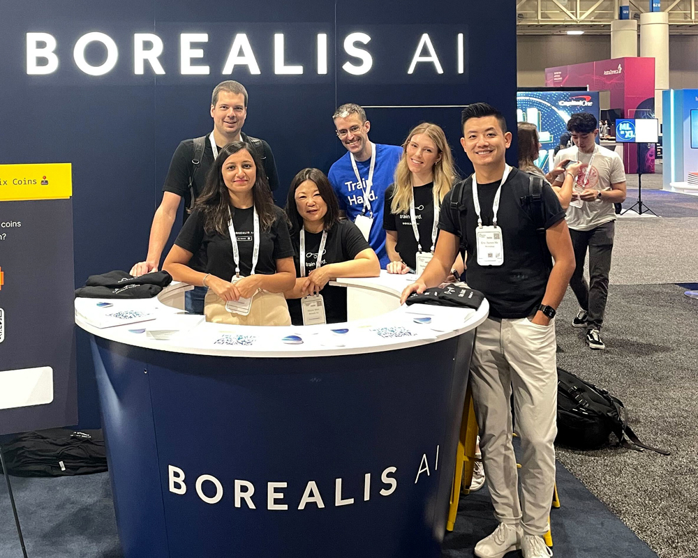 The Borealis AI Team at the NeurIPS booth.